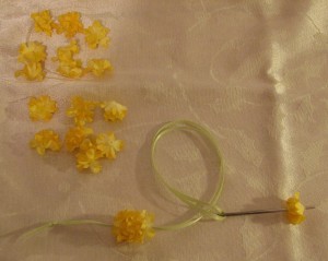 Stringing the first half of the flowers.